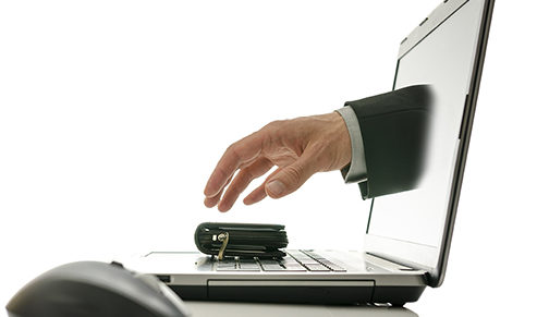hand reaching out of a computer to steal a wallet